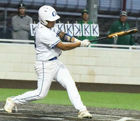 Olton senior, Jacob Marquez, knocks a single past second base, during the bottom of the fourth inning, of the Mustangs, 11-9, loss on Wednesday to New Deal in Littlefield. (Staff Photo by Derek Lopez)
