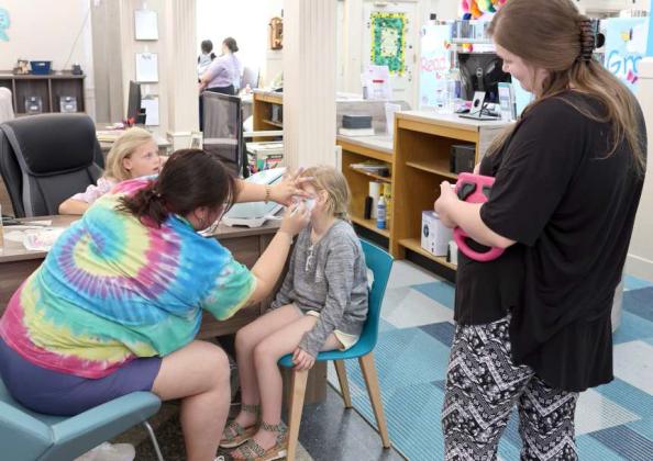 Face painting was a popular activity during the Ice Cream Social at the Lamb County Library on Saturday, April 13, 2024. (Photo by Ann Reagan)